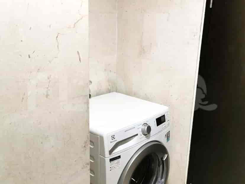 Laundry room with a washing machine.