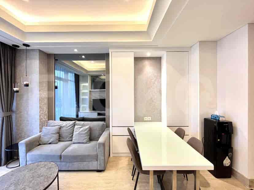 Living room with a sofa, dining area, and modern interior design.