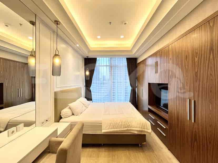 Bedroom with a bed, closet, and modern design.