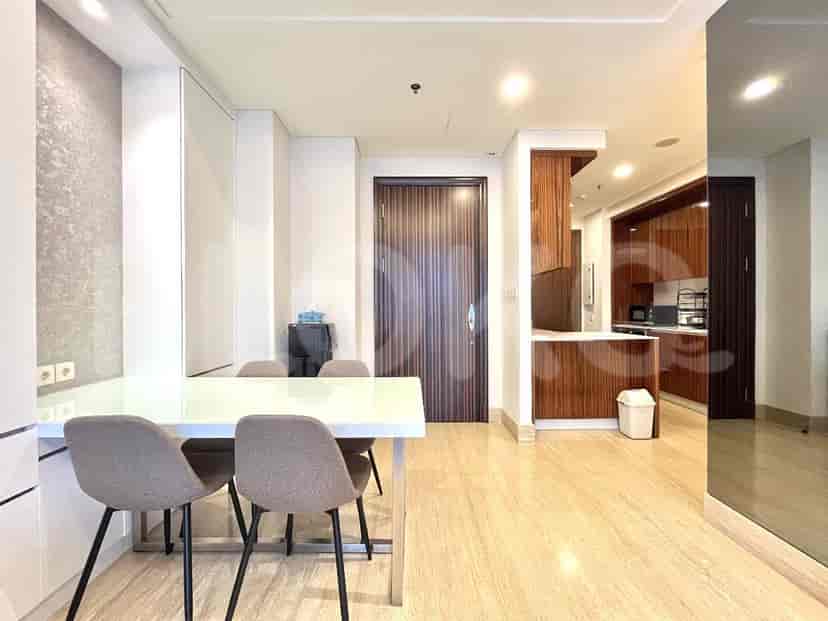 Living room, dining area, and kitchen with a modern design.