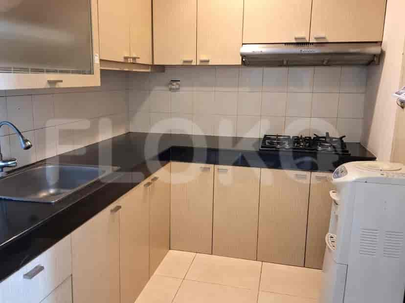 A kitchen with cabinets, countertop, and appliances.