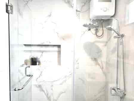 A luxurious bathroom with a glass shower.