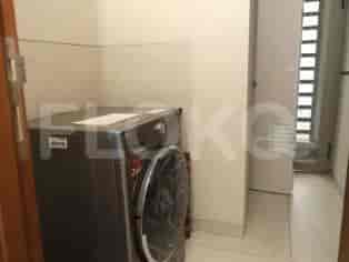 A laundry room with a washing machine.