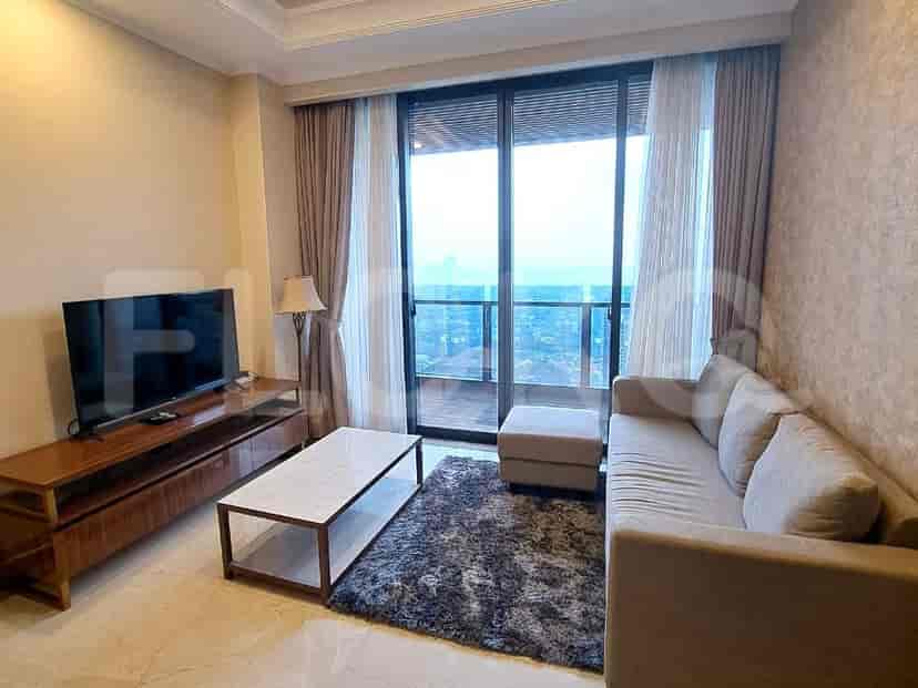 A modern living room with an L-shaped sofa, a wooden TV stand, and a large window offering a city view.