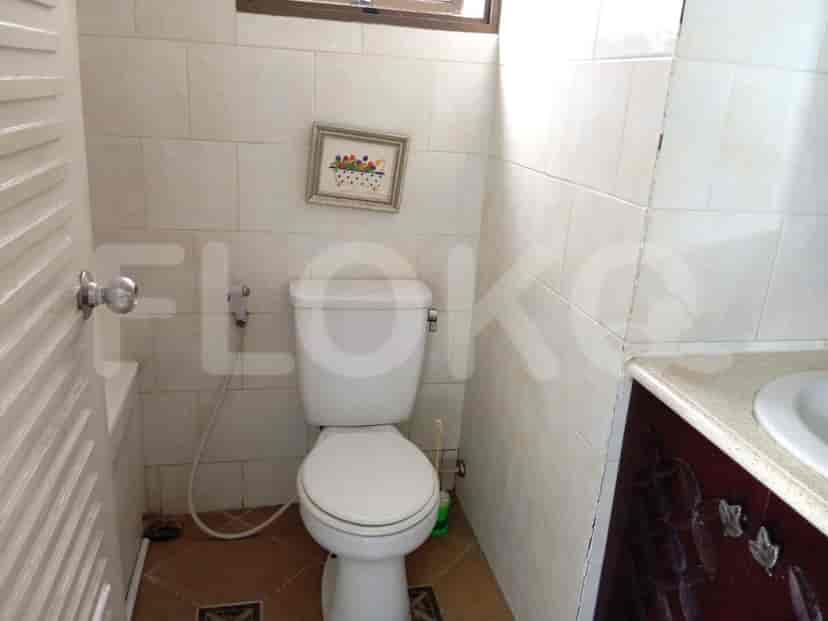 A small bathroom with a toilet and a sink.