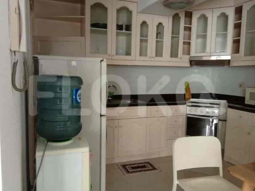 A kitchen featuring white cabinets and appliances.
