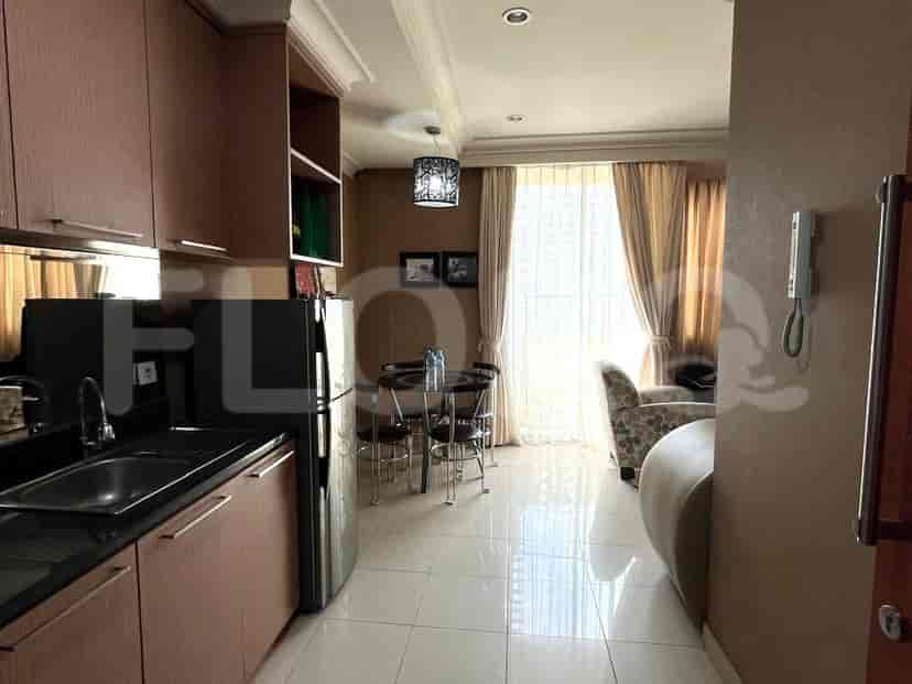 Kitchen with dining table, living area and stylish lighting