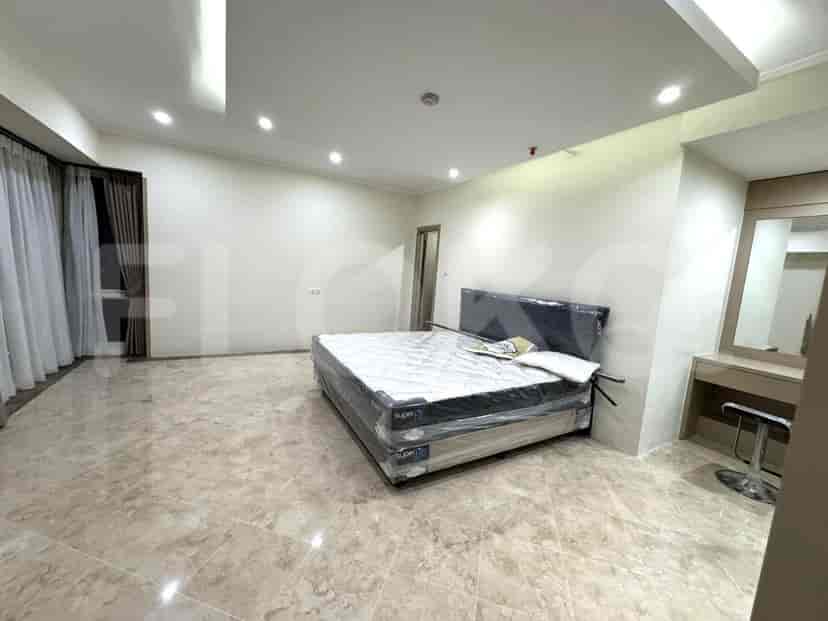 Bedroom with a king-size bed, marble flooring, and a modern design.