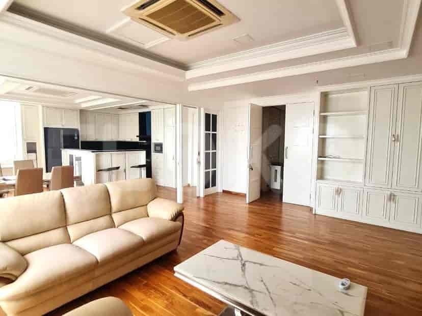 Open concept living area with kitchen, dining, and a stylish interior.