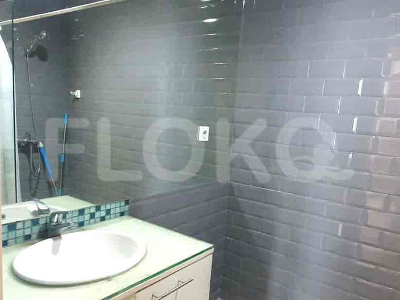 Bathroom with a shower, sink, and a large mirror.