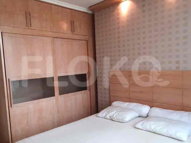 Bedroom with a bed and a large wardrobe.