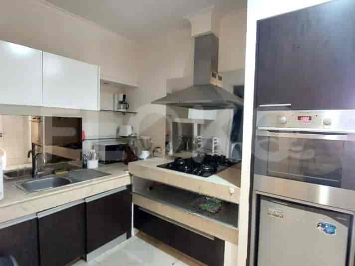 A modern kitchen with built-in appliances, a gas stove, and ample storage.