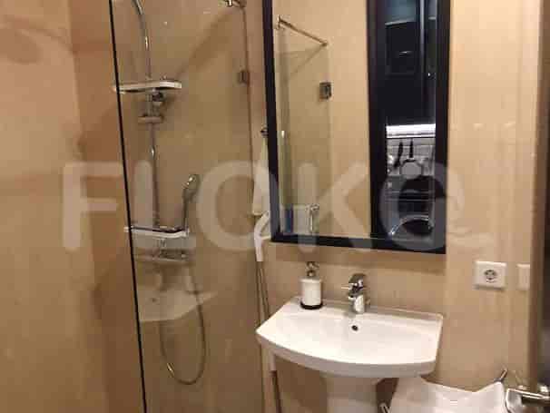 A bathroom with a shower and sink.