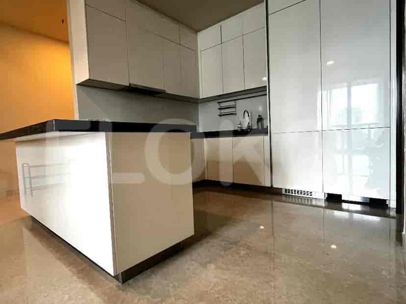 Kitchen with white cabinets and a large island.