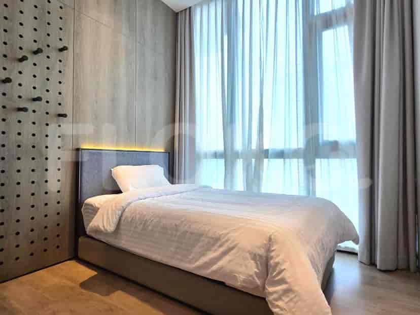 Bedroom with a double bed, wooden paneling, and a large window offering a city view.