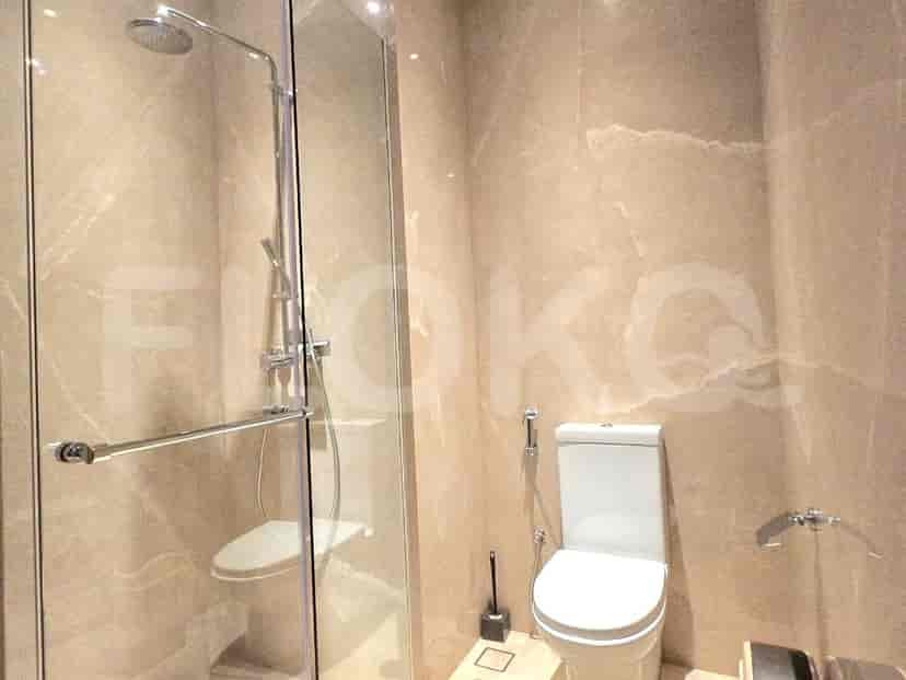 Bathroom featuring a shower, toilet and bidet.