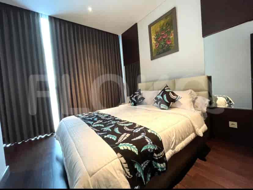 A well-appointed bedroom with a comfortable bed, a large mirror, and stylish decor.