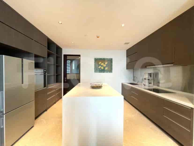 Modern kitchen with a central island and ample storage space.