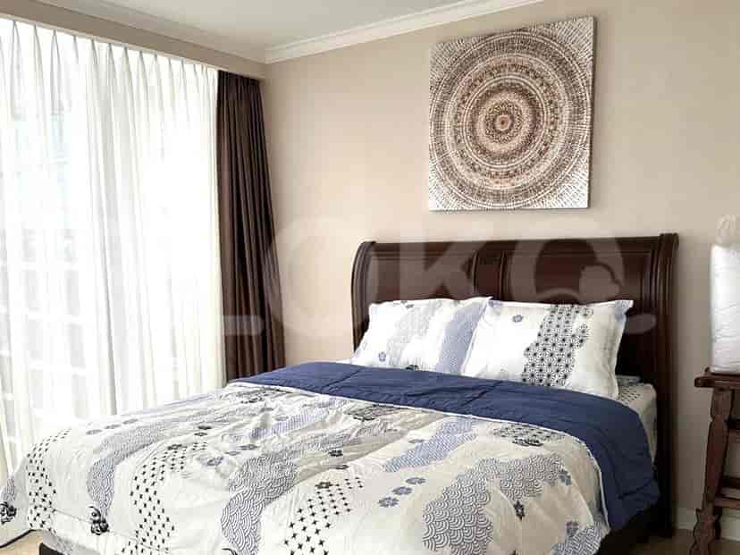Comfortable bedroom with a double bed and decorative artwork.