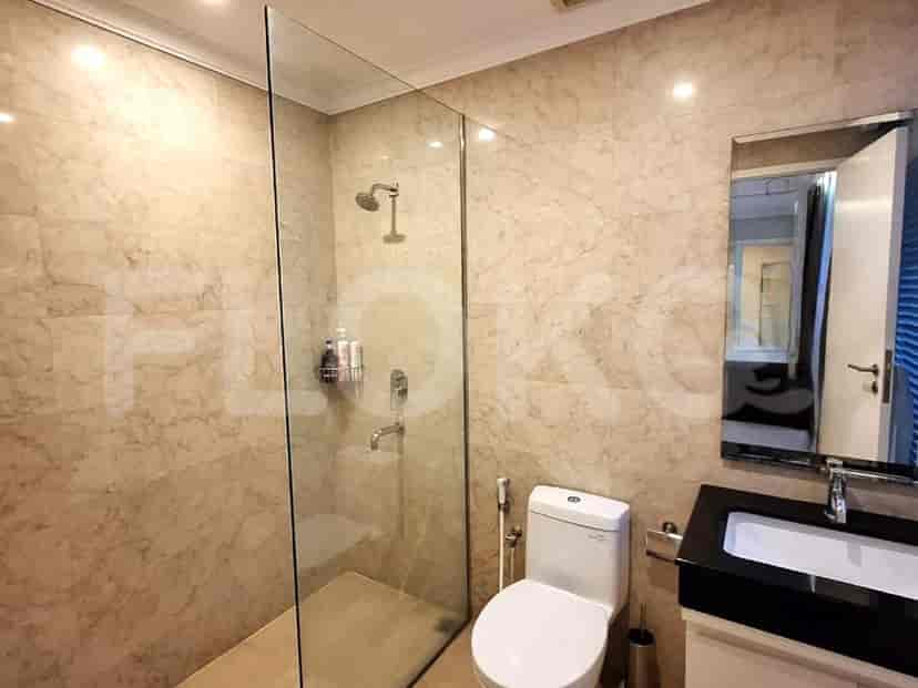 Modern bathroom with shower and toilet.