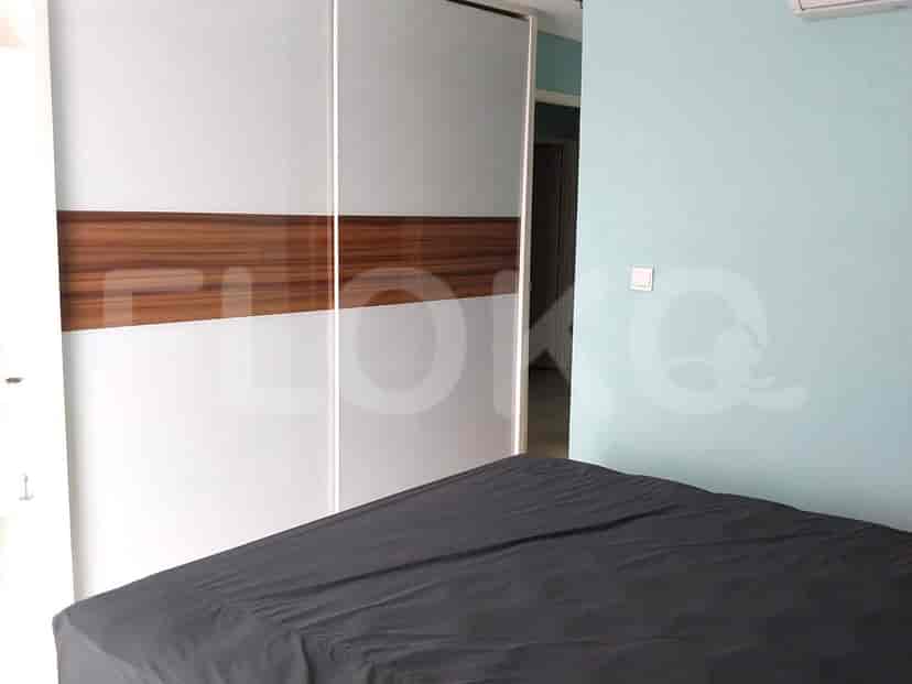 Bedroom with a bed and sliding closet.