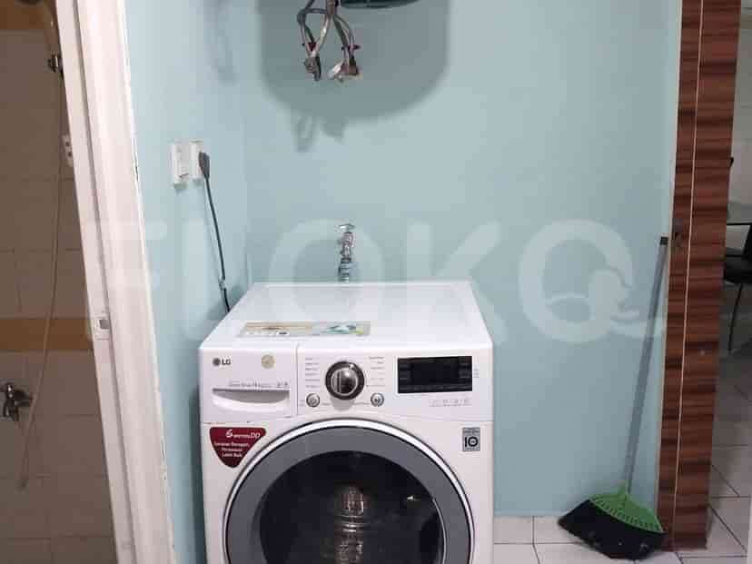 Laundry area with a washing machine.