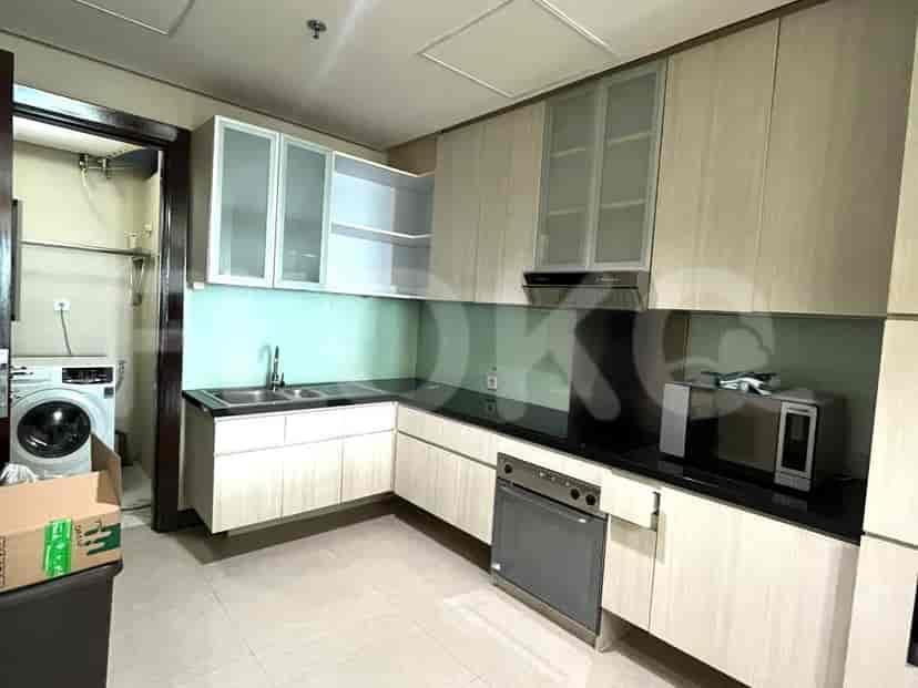 A modern kitchen with appliances and cabinets.