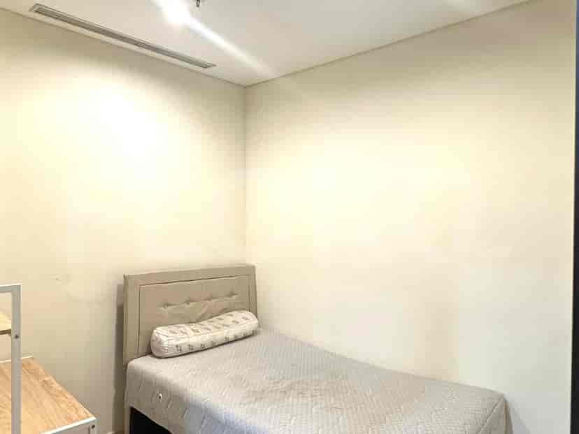 Small bedroom with a single bed.