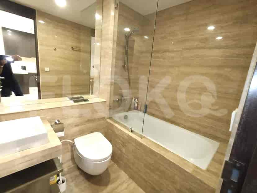 Bathroom with a bathtub, shower, and vanity.
