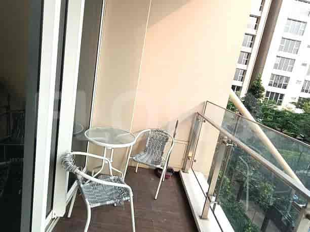 A small balcony with table and chairs.
