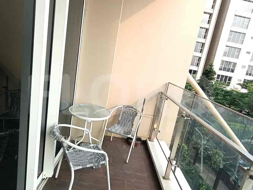 Balcony with table and chairs.