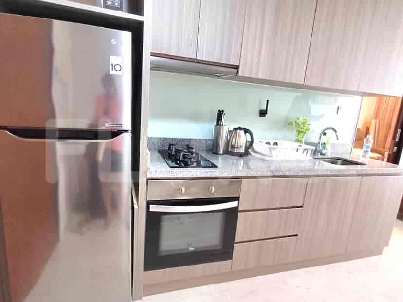 A modern kitchen with stainless steel appliances.