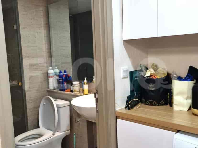 Bathroom and laundry area combined, with modern amenities.