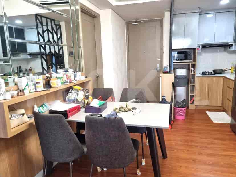 Dining area with dining table and view to kitchen