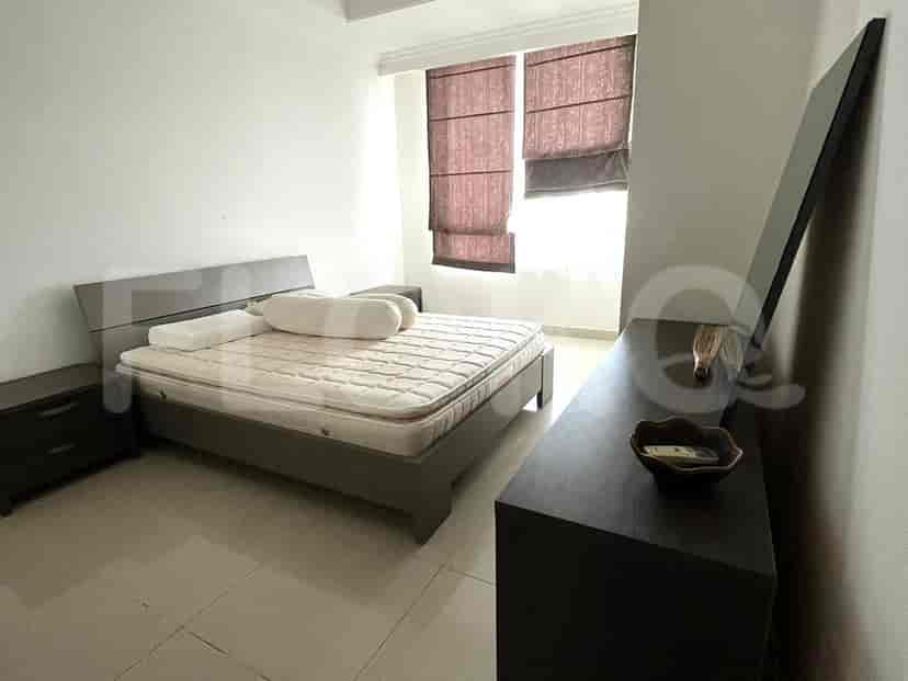 Bedroom with a bed, bedside tables, and a dresser.