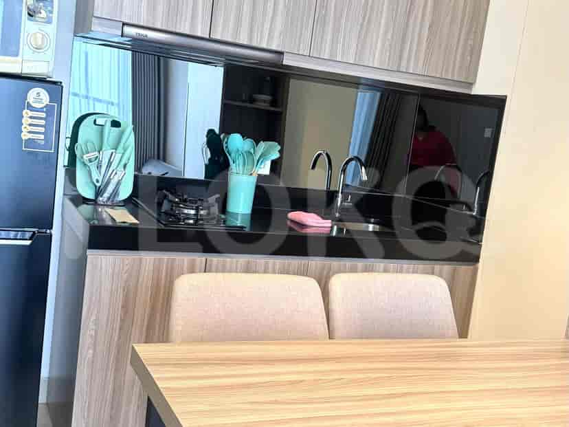 A well-equipped kitchen featuring wooden cabinets and appliances.