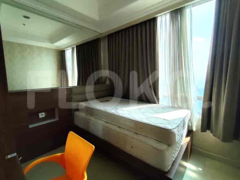 Bedroom with a bed and a view from the window.