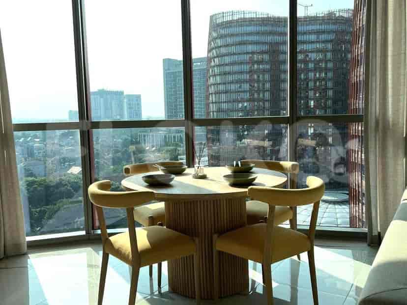 Dining area with a round wooden table.