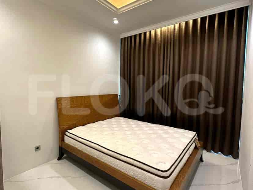 A bedroom with a bed and curtains, featuring a wood and minimalist design.