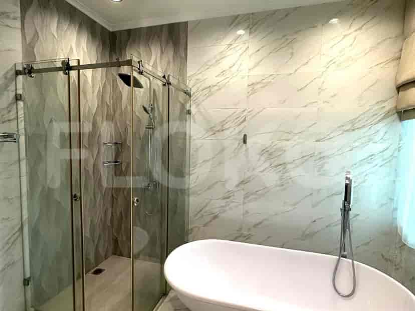 A bathroom with a shower and bathtub.