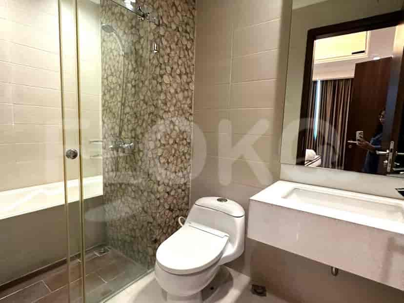 A bathroom with a bathtub and shower.