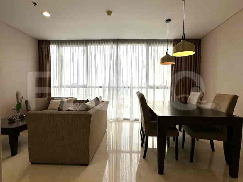A modern bedroom with a bed, closet, and neutral color scheme.