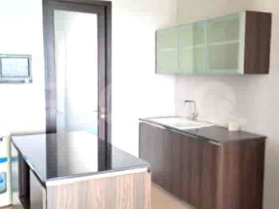 Kitchen with countertops and overhead cabinets.