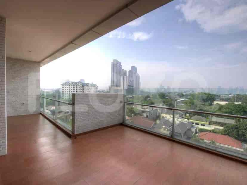 A spacious balcony with a beautiful city view.