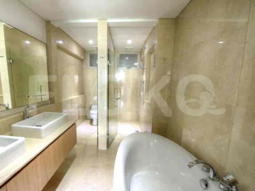 A luxury bathroom with a bathtub, walk-in shower and a double sink.