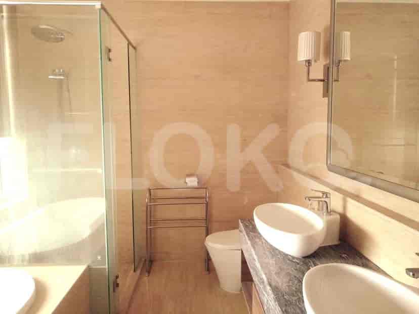 A bathroom with a floating vanity, neutral color palette, and modern fixtures.