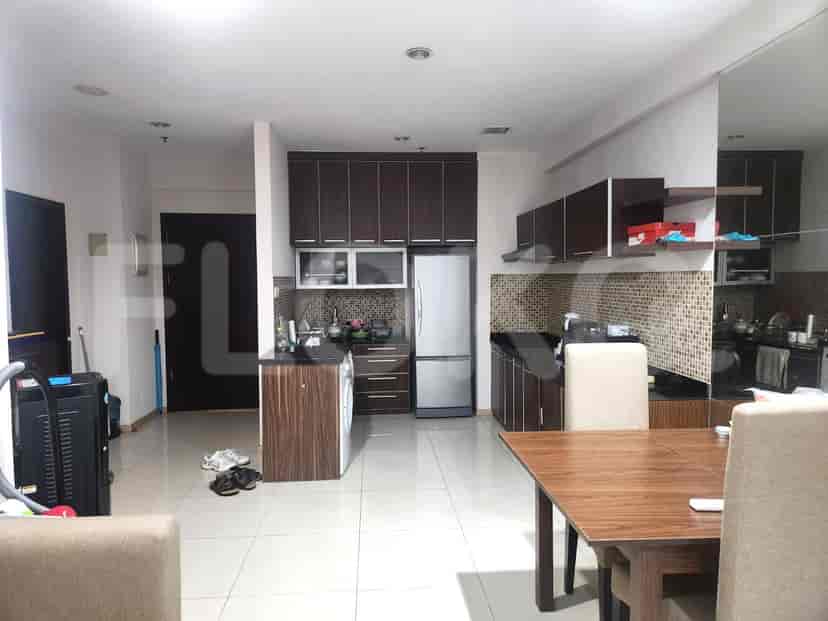 A kitchen featuring a modern design with ample storage.