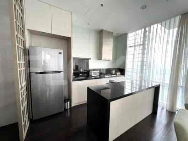 A modern, open kitchen with stainless steel appliances and a kitchen island.