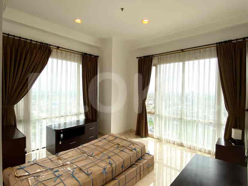 A spacious bathroom with a bathtub, shower, and vanity.
