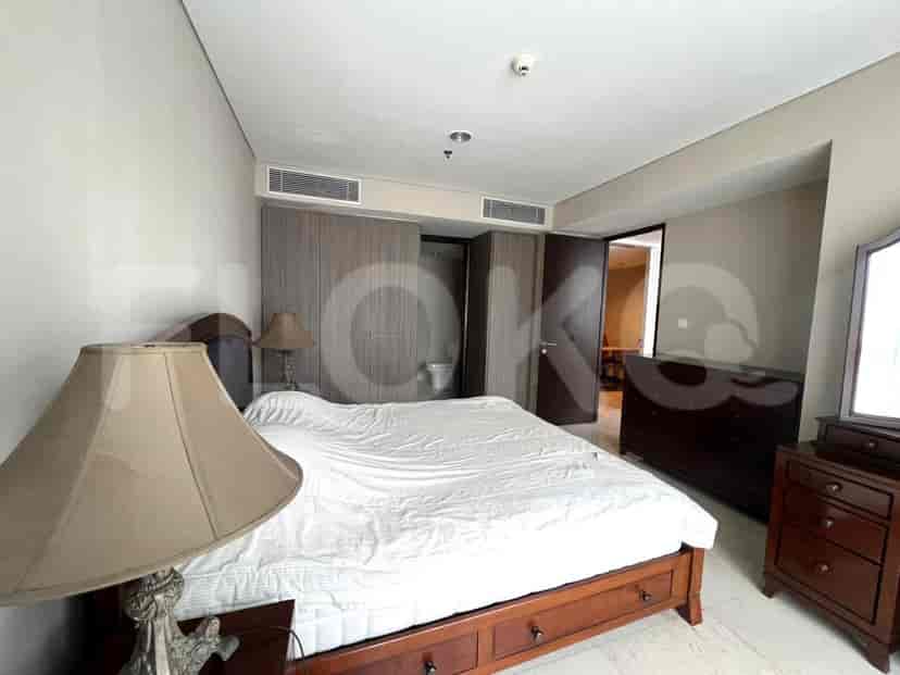 Master bedroom with large bed and side tables.